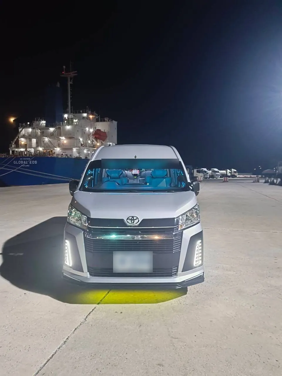 Silver Toyota Commuter VIP with LED lights at night