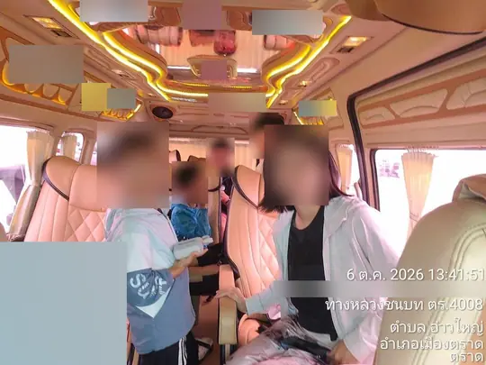 A family with children sits in the VIP cabin on its pale pink buttoned leather seats, under a gold-lit ceiling and pink curtains, in Ao Yai, Mueang Trat, Trat, at 1:41 p.m. on 6 October 2026.